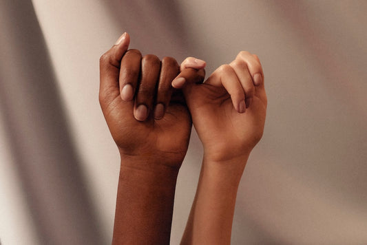Two people holding hands